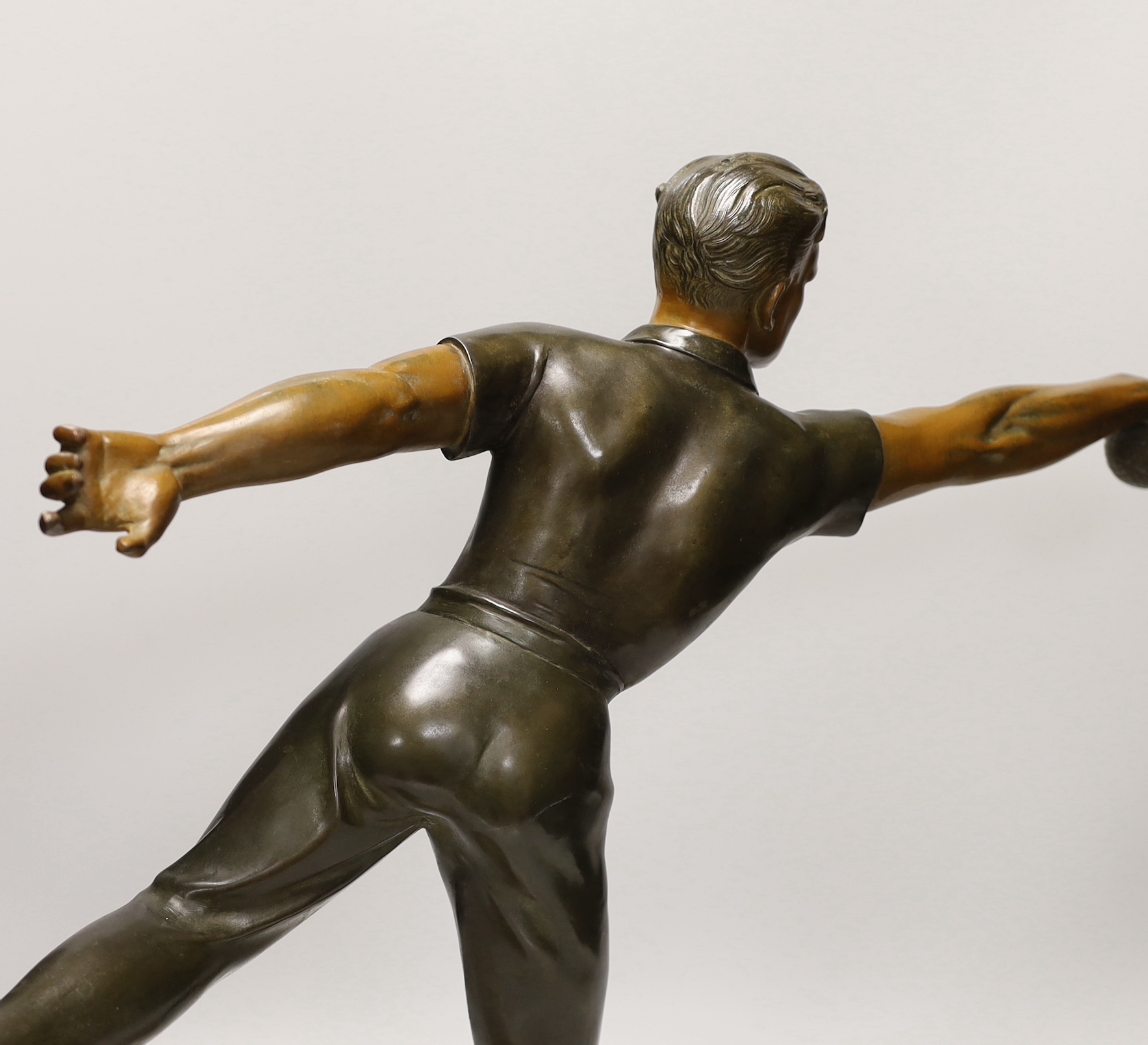 A French Art Deco spelter figure 'Petanque player' 60cm wide, 50cm high